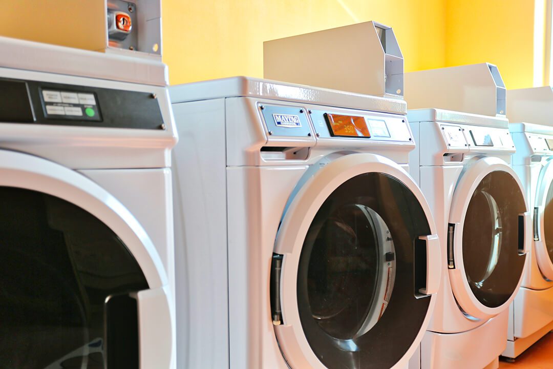 Commercial washers in the 24-hour laundromat at Sundowner Park