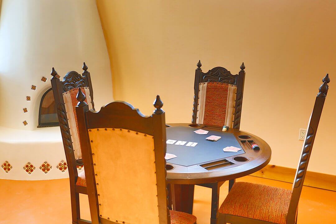 Card table by the fireplace in the Sundowner Park clubhouse lounge